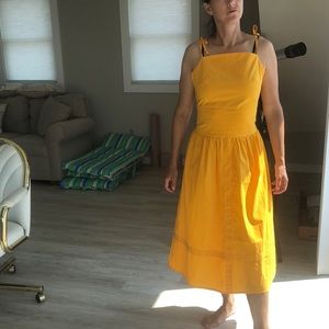 Madisonne bright golden yellow sundress with adjustable tie straps. Size M/6